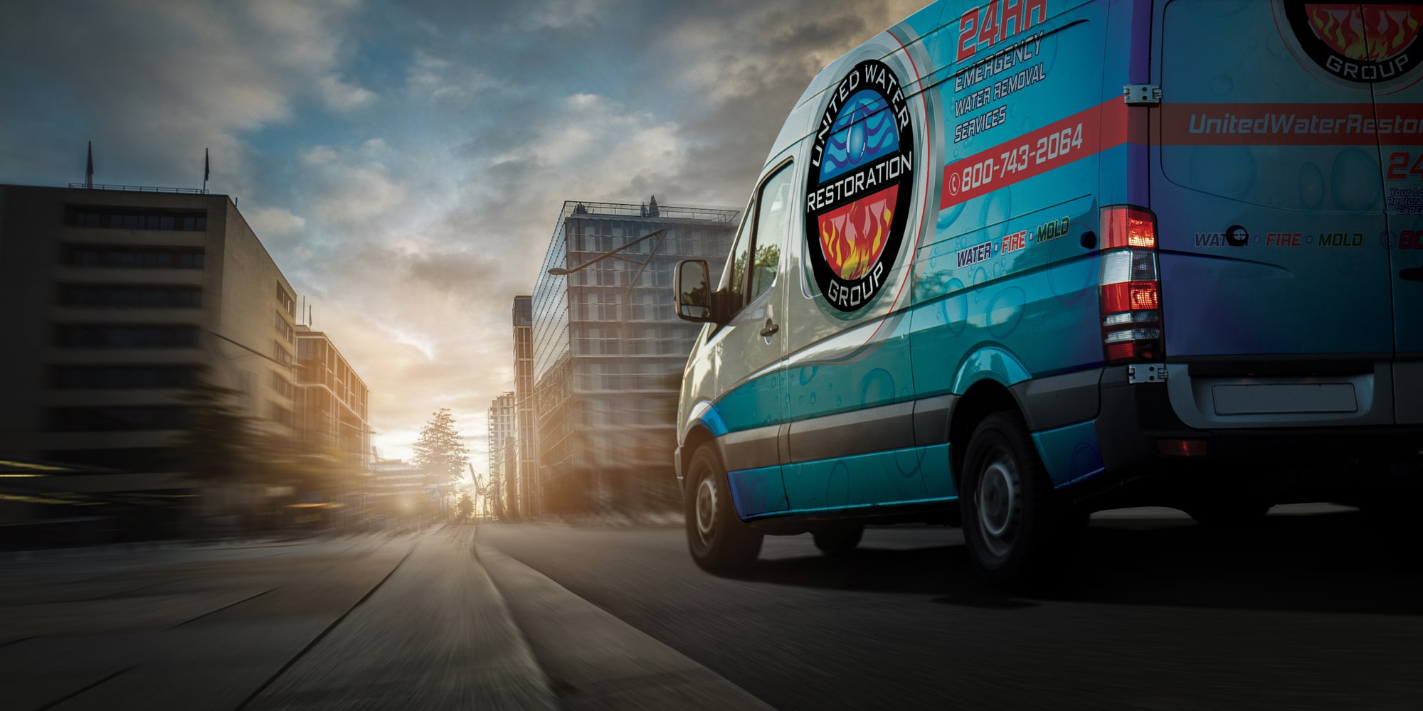 A United Water Restoration Group of Hayward van heading out on an emergency call at sunset